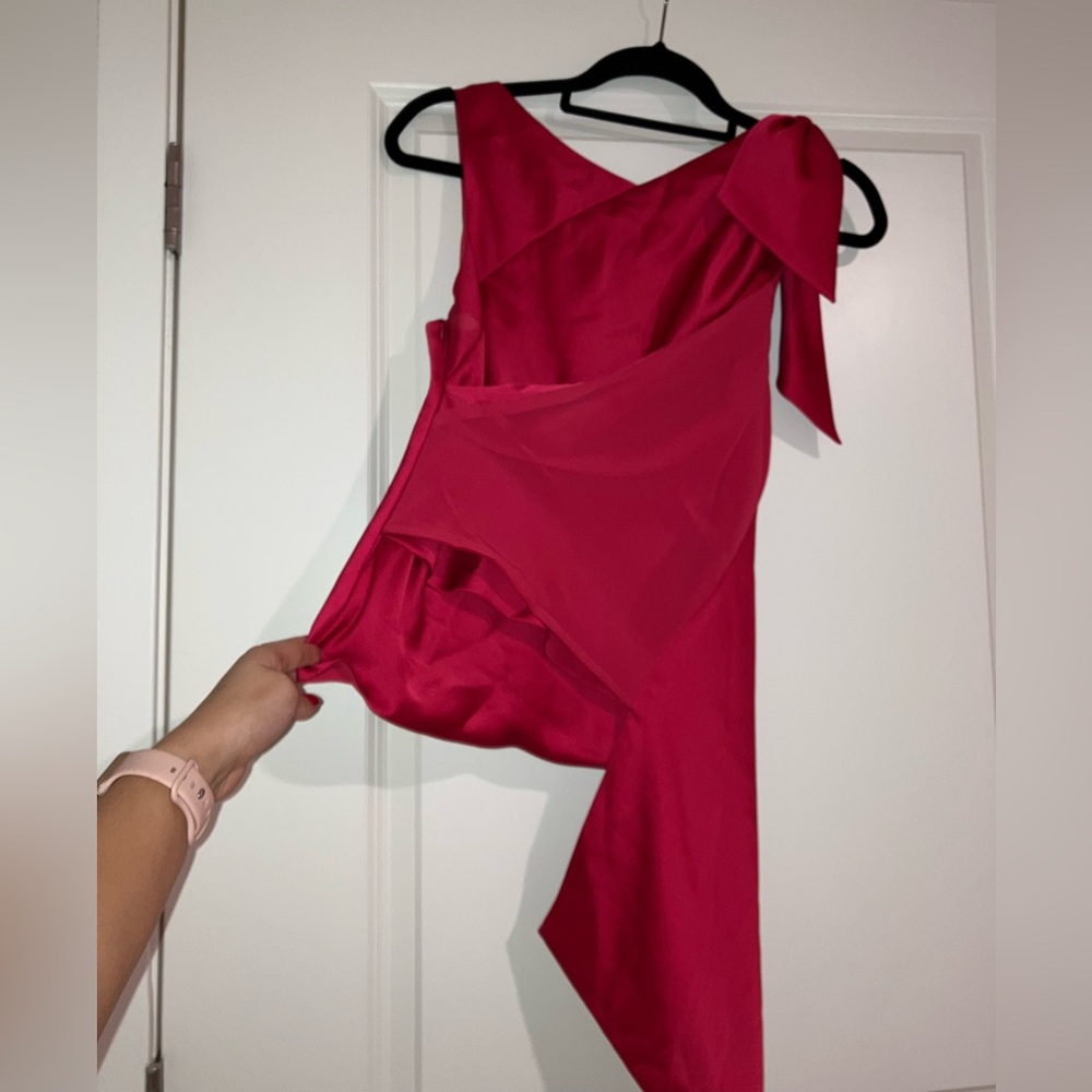 Pink Karen Millen asymmetric satin blouse with tie shoulder and drape front.